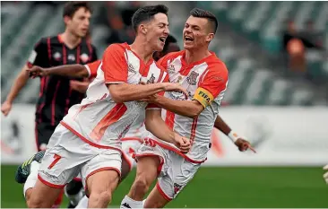  ??  ?? Birkenhead United striker Alex Connor-mclean celebrates his goal with team-mate Sam Burfoot during yesterday’s Chatham Cup final. The match ended 1-1 after extra time and Birkenhead went on to win the penalty shootout 5-4.