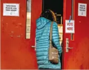  ?? TENNESSEE LOOKOUT PHOTO BY JOHN PARTIPILO ?? A woman enters the Shelby Park Community Center in Nashville to vote March 5 in the Super Tuesday primary.