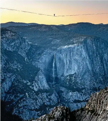  ?? AP ?? In a photo provided by Scott Oller Films, highliner Daniel Monterrubi­o walks the 853m line off Taft Point above Yosemite Valley in Yosemite National Park, California.