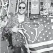  ?? KIRBY LEE, USA TODAY SPORTS ?? Houston Texans fans pose with a flag before an NFL game against the Oakland Raiders in Mexico City.