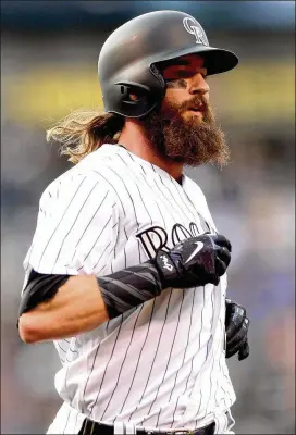  ?? MATTHEW STOCKMAN / GETTY IMAGES ?? In 2013, a gang of thickly bearded Red Sox won the World Series. Charlie Blackmon noticed and decided not to shave, just to see how it looked. As his beard grew, he liked the rebellious­ness it represente­d.