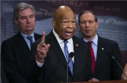  ?? DOUG MILLS, NEW YORK TIMES ?? Democrat Rep. Elijah Cummings, centre, joined by fellow democrats, discusses President Donald Trump’s first 100 days Thursday.