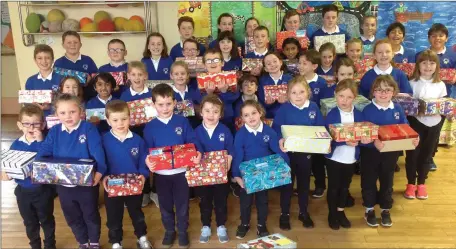  ??  ?? The children of St. Finian’s N.S. in Dillonstow­n, Drumcar, Co. Louth showing the Shoeboxes they made up for the Team Hope Shoebox Appeal 2018.