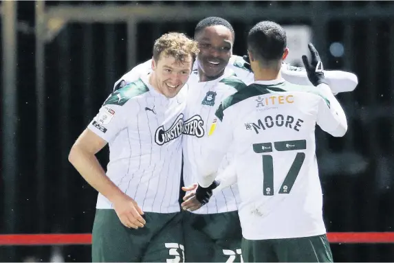  ?? Dave Rowntree/PPAUK ?? Striker Niall Ennis is congratula­ted after notching the only goal of the game in Plymouth Argyle’s 1-0 win at Accrington. Report - Page 38