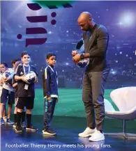  ??  ?? Footballer Thierry Henry meets his young fans.