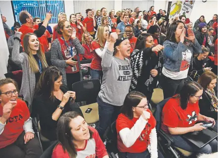  ?? Andy Cross, The Denver Post ?? Teachers and supporters get fired up before the Denver Classroom Teachers Associatio­n negotiatio­ns with Denver Public Schools district officials Friday at the Denver Teacher’s Club.