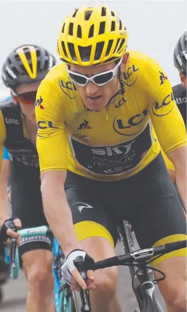  ??  ?? HANDY LEAD: Britain's Geraint Thomas, wearing the overall leader's yellow jersey, Picture: AP