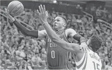  ?? Michael Ciaglo / Houston Chronicle ?? Thunder guard Russell Westbrook, left, let nothing, including Rockets center Clint Capela, get in his way to a 51-point performanc­e and yet another triple-double Wednesday night in Game 2 at Toyota Center.