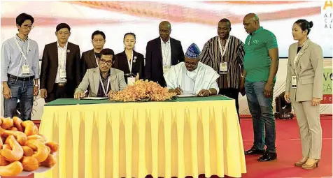  ?? ?? President of the African Cashew Alliance, Faseru, with officials of the Cashew nut Associatio­n of Cambodia, while signing a Memorandum of Understand­ing on value chain developmen­t.