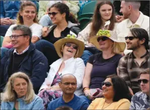  ?? (AP/Alastair Grant) ?? Spectators wearing tennis-themed hats sit on Court No. 3 on Thursday at the Wimbledon Tennis Championsh­ips.