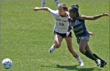  ?? Terrance Armstard/News-Times ?? In hot pursuit: El Dorado's Autumn Seemann battles Greenwood's Erin Fowler for possession of the ball.The Lady Bulldogs beat the Lady Wildcats in a shootout Saturday after the score was tied 2-2 after regulation.