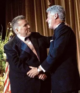  ?? ?? Activist David Mixner introduces President Clinton for a speech to the Access Now for Gay and Lesbian Equality dinner in 1999. Mixner died Monday at age 77.
