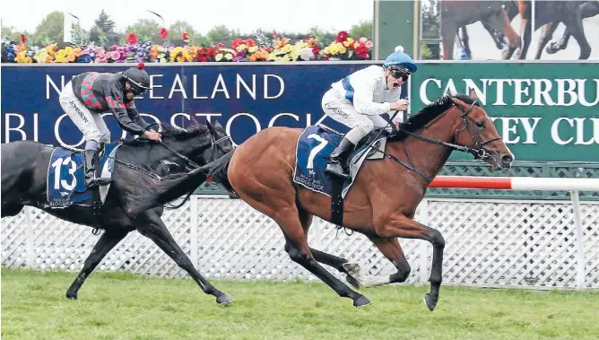  ?? PHOTO: RACE IMAGES CHRISTCHUR­CH ?? Capping a huge week for trainers Stephen Autridge and Jamie Richards and jockey Matt Cameron, Risque wins the NZB 1000 Guineas from fellow Matamata filly Strada Cavallo.