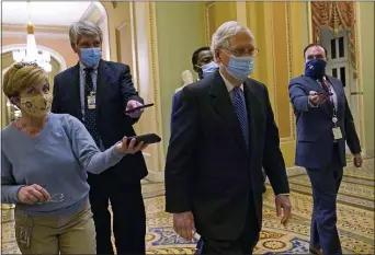  ?? SUSAN WALSH — THE ASSOCIATED PRESS ?? Senate Majority Leader Mitch McConnell of Ky. walks past reporters on Capitol Hill in Washington, Tuesday, Dec. 15, 2020.