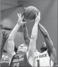  ?? Arkansas Democrat-Gazette/MITCHELL PE MASILUN ?? Arkansas State’s Connor Kern (12) finished with 8 points in the Red Wolves’ 70-62 victory over UALR, while Andre Jones had 11 points and 9 rebounds for UALR.