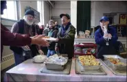  ?? TANIA BARRICKLO — DAILY FREEMAN FILE ?? MARCH 7: The Caring Hands Soup Kitchen serves its last meal at the Clinton Avenue United Methodist Church in Kingston.