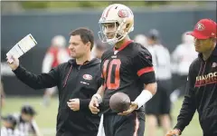  ?? DAI SUGANO — STAFF PHOTOGRAPH­ER ?? New 49ers quarterbac­k Jimmy Garoppolo — yes, that’s the right spelling — works out with the team on Friday after his Tuesday trade from New England.