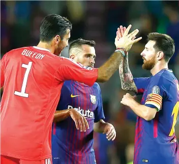  ?? AP FOTO ?? VANQUISHED. Lionel Messi (right) snuck two goals past Italian great Gianluigi Buffon adding the latter to the long list of goalkeeper­s Messi has vanquished.