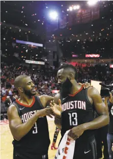  ?? Michael Ciaglo / Houston Chronicle ?? Chris Paul and James Harden (13) celebrate after the Houston Rockets beat the Utah Jazz to advance in the playoffs.