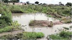  ?? Picture: SUPPLIED ?? DANGEROUS: A water-filled trench in an open field near the taxi rank has cost two lives.