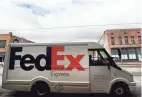  ?? JOE RONDONE/THE COMMERCIAL APPEAL ?? A Fedex truck delivers packages along South Main Street during the coronaviru­s pandemic on March 31.