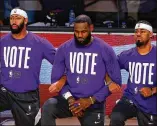  ?? TNS ?? Lebron James, (center) launched the group More Than A Vote, which is drawing attention to what it says are attempts in Georgia and other battlegrou­nd states to roll back voting rights.