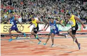  ??  ?? Justin Gatlin (left) wins the Men’s 100m ahead of Usain Bolt in a race he should never have been able to compete in, said athlete Jo Pavey