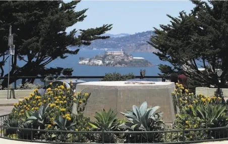  ?? Justin Sullivan / Getty Images ?? A concrete pedestal at Coit Tower plaza, above, stands empty after a statue of Christophe­r Columbus was removed. Oakland City Councilwom­an Nikki Fortunato Bas, below, is calling for $25 million in police spending to be redirected to social programs.