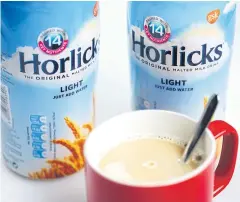  ?? BLOOMBERG ?? Jars of Horlicks, the light malted milk drink produced by GlaxoSmith­Kline Plc, sit arranged for a photograph in London on Wednesday.