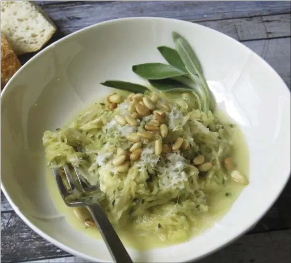  ?? SARA MOULTON VIA AP ?? Spaghetti squash with creamy goat cheese sauce and shredded zucchini