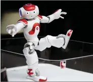  ??  ?? A ‘’Nao’’ humanoid robot, by Aldebaran Robotics that offers basic service informatio­n, moves during a presentati­on in 2015.