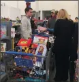  ?? COURTESY PHOTOGRAPH ?? Members of the Lodi Youth Commission buy gifts at Lodi’s Super Wal-Mart on Monday. The gifts were donated to Lodi Adopt-A-Child. The members of the Youth Commission are Chris Anaforian, Emma Colarossi, Hope Lorentzen, Evan Seibly, Harlie Litton,...