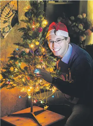  ?? Pictures: JAMES DADZITIS/SWNS ?? Ross shows off the fairy lights – bought 48 years ago and still a shining example