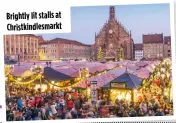  ?? ?? Brightly lit stalls at Christkind­lesmarkt