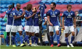  ??  ?? Cardiff’s Junior Hoilett celebrates his opening goal against Leeds by paying tribute to former player Peter Whittingha­m, who passed away earlier this year. Photograph: David