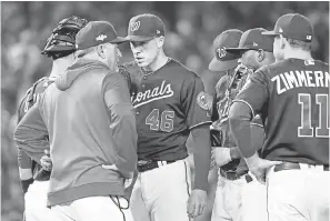  ?? GEOFF BURKE/ USA TODAY SPORTS ?? Nationals pitcher Patrick Corbin has a meeting on the mound during Game 4 of the NLCS.