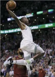  ?? CHARLES KRUPA - THE ASSOCIATED PRESS ?? Boston Celtics guard Terry Rozier soars toward the basket past Cleveland Cavaliers forward LeBron James during the second half in Game 2of the NBA basketball Eastern Conference finals, Tuesday, May 15, 2018, in Boston.