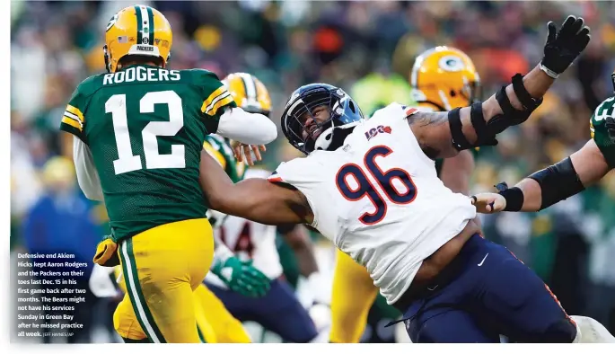  ?? JEFF HAYNES/AP ?? Defensive end Akiem Hicks kept Aaron Rodgers and the Packers on their toes last Dec. 15 in his first game back after two months. The Bears might not have his services Sunday in Green Bay after he missed practice all week.