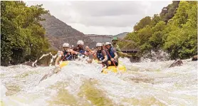  ?? WEST VIRGINIA TOURISM OFFICE ?? Rafters ride the rapids on the New River, which, despite its name, is considered by geologists to be one of the oldest rivers in the world.