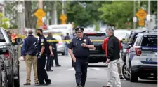  ?? MATT sTonE / HErAld sTAFF FIlE ?? ONE OF 20: Police investigat­e a fatal shooting May 28 in Dorchester. The number of people fatally shot has dropped from 37 last year.