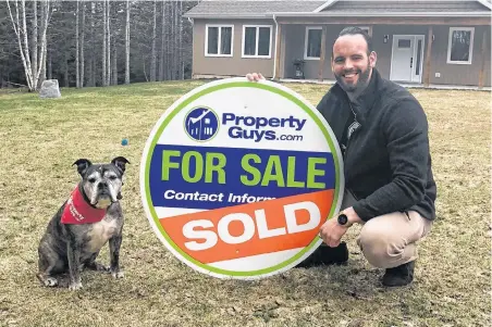  ?? GREG MCNEIL/CAPE BRETON POST ?? Jesse Denton, a new Property Guys franchise owner, and his dog Diesel are shown outside of one the homes he has for sale on Mountain Road, Coxheath. Denton purchased the franchise in January.