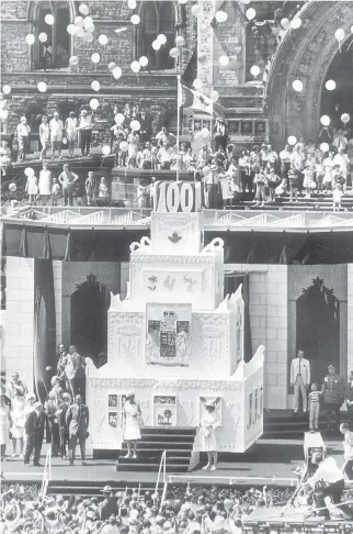  ??  ?? The Centennial cake, 1967, was constructe­d of plywood, nails and Styrofoam. But it had an insert of real cake in the front, for the Queen to cut, and was coated with real icing, made with 700 pounds (317 kg), of icing sugar.