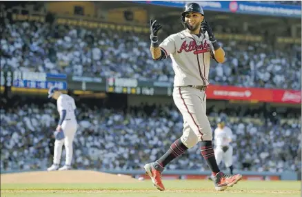  ?? EDDIE ROSARIO, Wally Skalij Los Angeles Times ?? shown during Game 3, and the heart of the Braves’ lineup outplayed the Dodgers. He was selected series MVP.