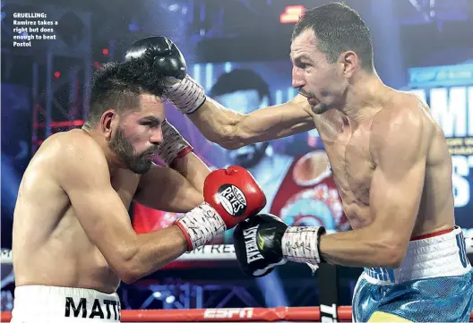  ?? Photo: MIKEY WILLIAMS/TOP RANK ?? GRUELLING: Ramirez takes a right but does enough to beat Postol