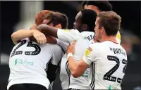  ??  ?? JOSH THE JOB: Onomah is mobbed by team-mates