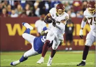  ?? Terrance Williams / Associated Press ?? Washington Football Team tight end Logan Thomas (82) runs the ball against New York Giants nose tackle Austin Johnson during the first half on Thursday in Landover, Md.