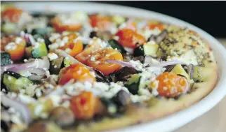  ??  JULIE OLIVE /OTTAWA CITIZEN ?? The Parlour Pizza Kitchen & Bar on Greenbank Road serves The Answer, a vegetarian pizza that, without question, delivers bright flavours with its generous mix of roasted vegetables.