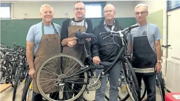  ?? SUPPLIED PHOTO ?? Volunteers Terry Weiner, Mark Gaudet, Michel Lapointe and Ken Eden of Bikes for Farmworker­s are looking for donations of used bikes to repair so that they can have ready for migrant workers who will arrive in Niagara-on-theLake next spring.
