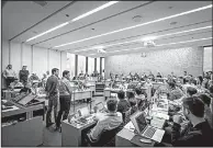  ?? The New York Times/AARON VINCENT ELKAIM ?? Iman Khodadad (left) and Farnoud Kazemzadeh, founders of Elucid Labs, which uses artificial intelligen­ce to develop imaging devices, take questions at the University of Toronto in early April.