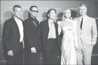  ?? ?? Director Christophe­r Nolan, cast members Matt Damon, Robert Downey Jr., Cillian Murphy and Emily Blunt pose during a photocall before the premiere of the film "Oppenheime­r" at the Grand Rex in Paris, France, July 11, 2023. (Reuters photo)